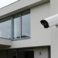 modern-white-cctv-camera-installed-on-a-commercial-building-exterior-1024x559